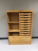 A mid twentieth century teak shutter door office cupboard