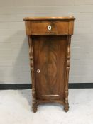 A late 19th century mahogany pillar cabinet