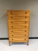 A 20th century pine seven drawer chest
