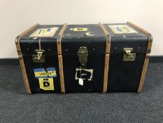 A wooden bound travelling trunk