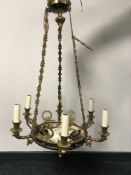 A decorative brass six way chandelier