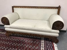 A nineteenth century scroll ended settee,