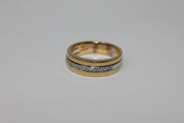 An 18ct gold diamond half eternity ring, size M/N.