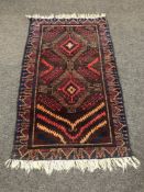 A Persian rug of geometric design,