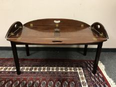 A traditional style mahogany butler's tray with lift up handles,