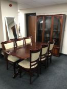 A stained pine extending dining table and six chairs