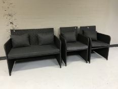 A rattan three piece suite