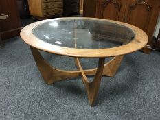 A circular teak G-plan coffee table
