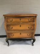 An early twentieth century painted pine three drawer chest on cabriole legs