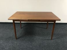 A Danish mid 20th century teak extending dining table CONDITION REPORT: This