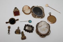 A collection of antique jewellery to include cameo brooches, intaglio seals, agate brooch,