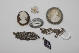 A collection of silver jewellery including cameo brooches,