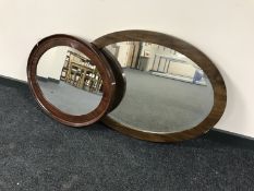 An oval mahogany framed mirror and one other