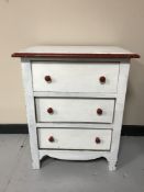 A twentieth century painted pine three drawer chest