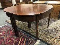 An early nineteenth century D-end extending dining table, width 122 cm.