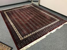A Tekke design carpet on red ground,