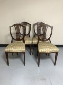 A set of four mahogany shield backed chairs