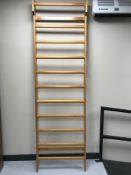 A pine wall mounted clothes rail