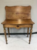 A late nineteenth century mahogany turnover-top table