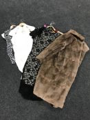 A lady's fur coat together with ten new fashion dresses