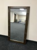 An oak framed over mantel mirror
