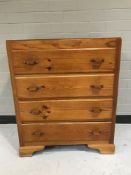 A pine four drawer chest