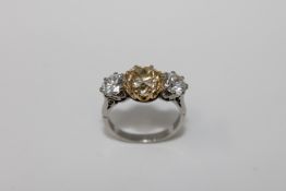 A superb quality three stone diamond ring in 18ct white gold,