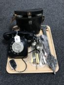 A tray of vintage bakelite telephone, pair of cast metal door hasps, assorted cutlery,