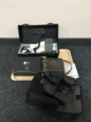 A tray of Declom Airband transceiver together with two sets of binoculars,