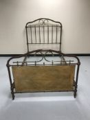 A painted metal and brass 4' bed frame