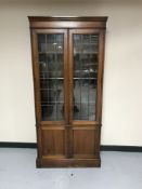 A late Victorian mahogany glazed door bookcase