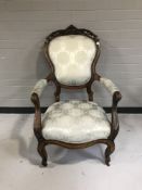 A late nineteenth century mahogany gentleman's armchair upholstered in blue brocade