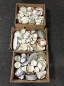 Three boxes of assorted English and European bone china cups and tea plates