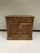 A contemporary double door sideboard fitted with a drawer