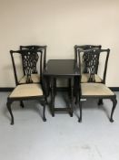 An oak gate leg table together with a set of four late Victorian chairs on Queen Anne style legs