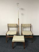 A pair of teak dining chairs,