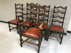 A set of five antique oak dining chairs comprising of two carvers and three singles