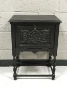 An oak cupboard on barleytwist legs