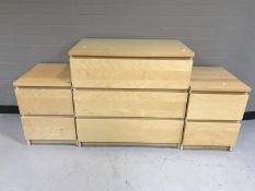 A contemporary beech effect three drawer chest together with pair of two drawer bedside chests