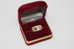 A silver gilt multi-tier cz dress ring