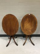 Two mahogany tilt topped occasional tables on tripod bases