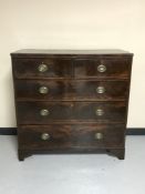 A Georgian mahogany five drawer chest on bracket feet