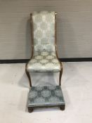A late nineteenth century mahogany bedroom chair upholstered in blue fabric together with carved