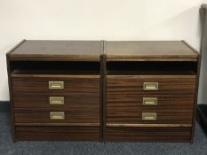 A pair of three drawer bedside stands with slide in a mahogany finish