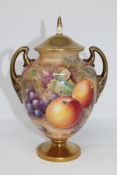 A Royal Worcester gilded lidded urn decorated with panels of fruit and berries, signed J.