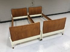 A pair of mid twentieth century teak 3' bed frames
