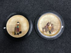 A pair of Bretby wall plaques depicting Dickens characters