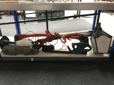 Three garden strimmers together with a Bosch trimmer,