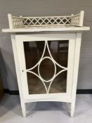 A painted pine glazed door cabinet with gallery