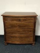 A late nineteenth century inlaid mahogany bow fronted chest
